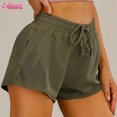 Wholesale Women's Sports Workout Shorts Breathable Laser Cut Jogging Shorts with Warm-up Zipper Side Pocket Solid Pattern