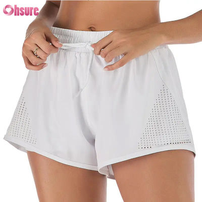 Wholesale Women's Sports Workout Shorts Breathable Laser Cut Jogging Shorts with Warm-up Zipper Side Pocket Solid Pattern